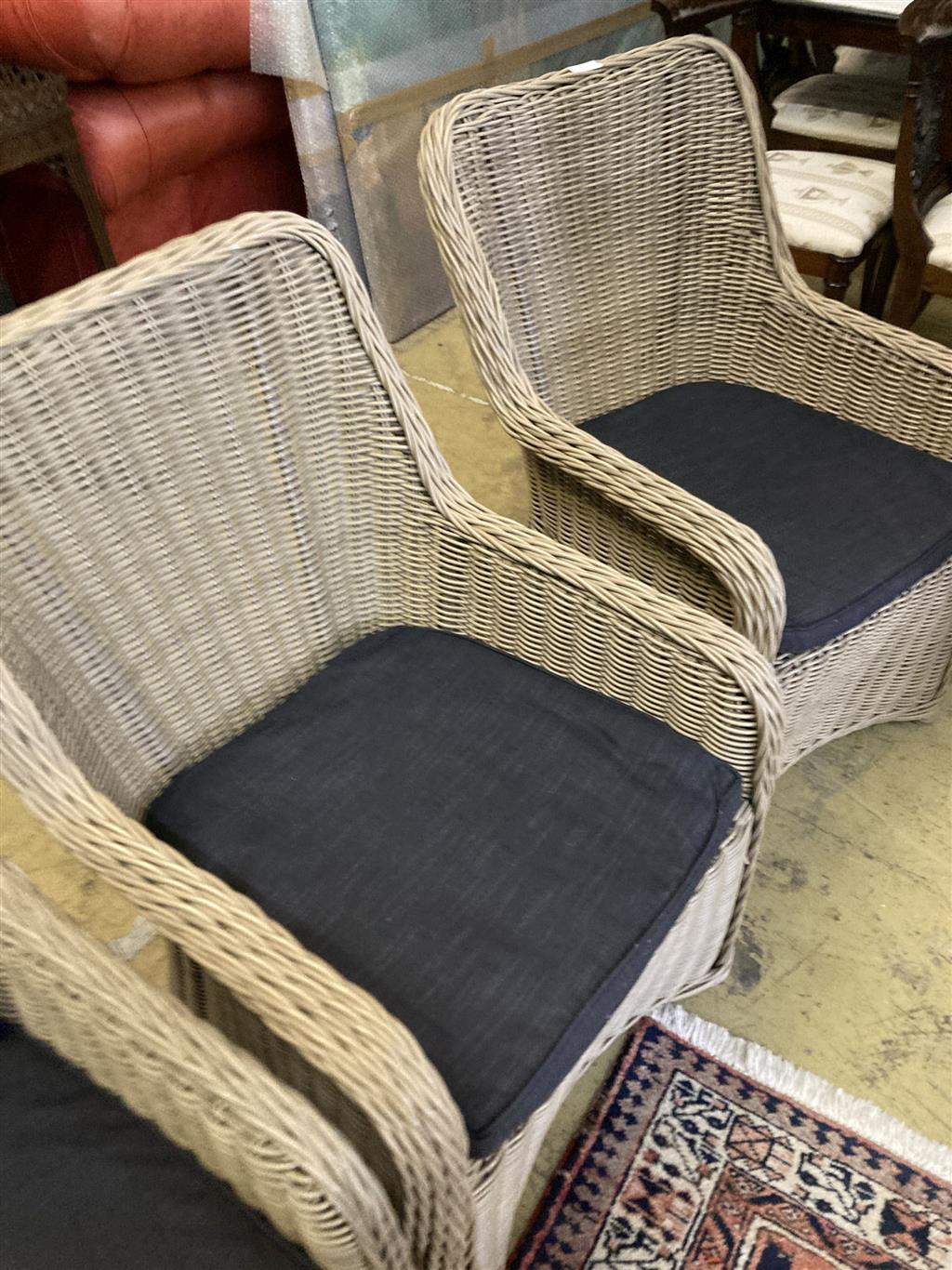 A set of six all weather rattan garden chairs, width 60cm, depth 60cm, height 95cm